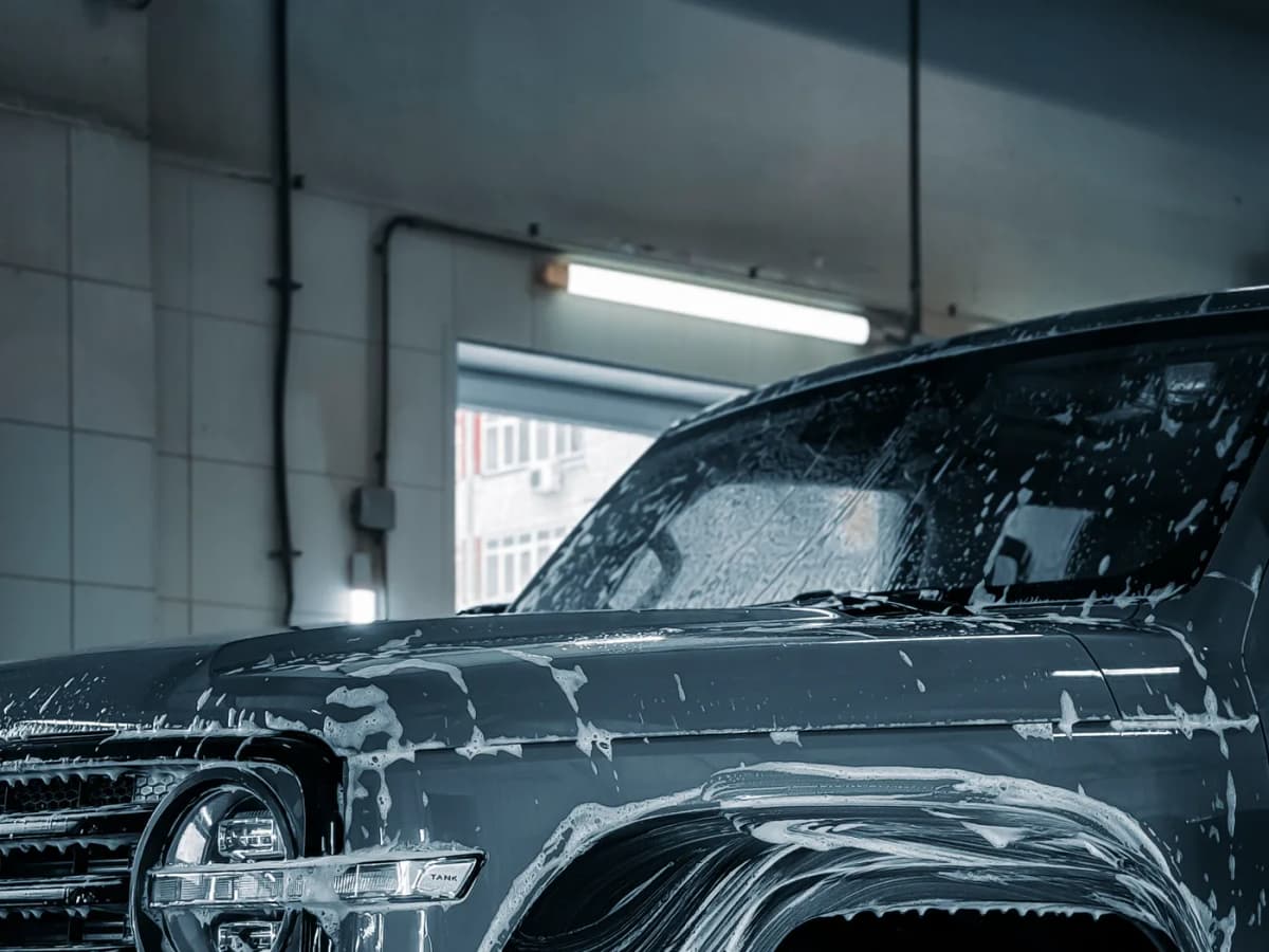 Luxury SUV covered in soap during a South Florida mobile detail